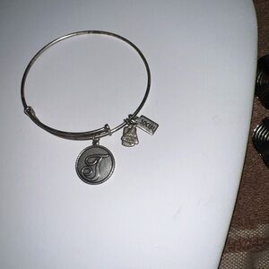 Shiny silver bangle bracelet.  , perfect condition charm included